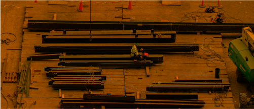steel beams in construction laydown yard